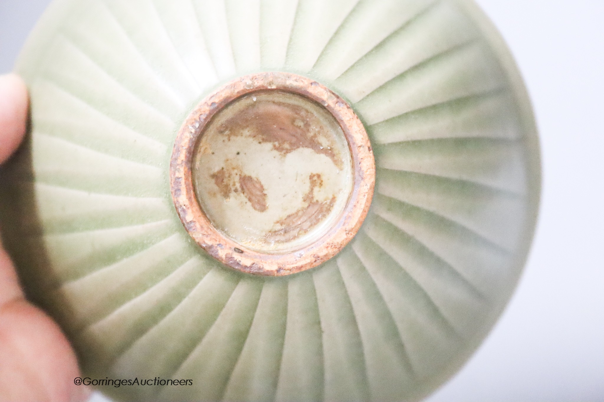 A Chinese carved celadon bowl, diameter 12cm